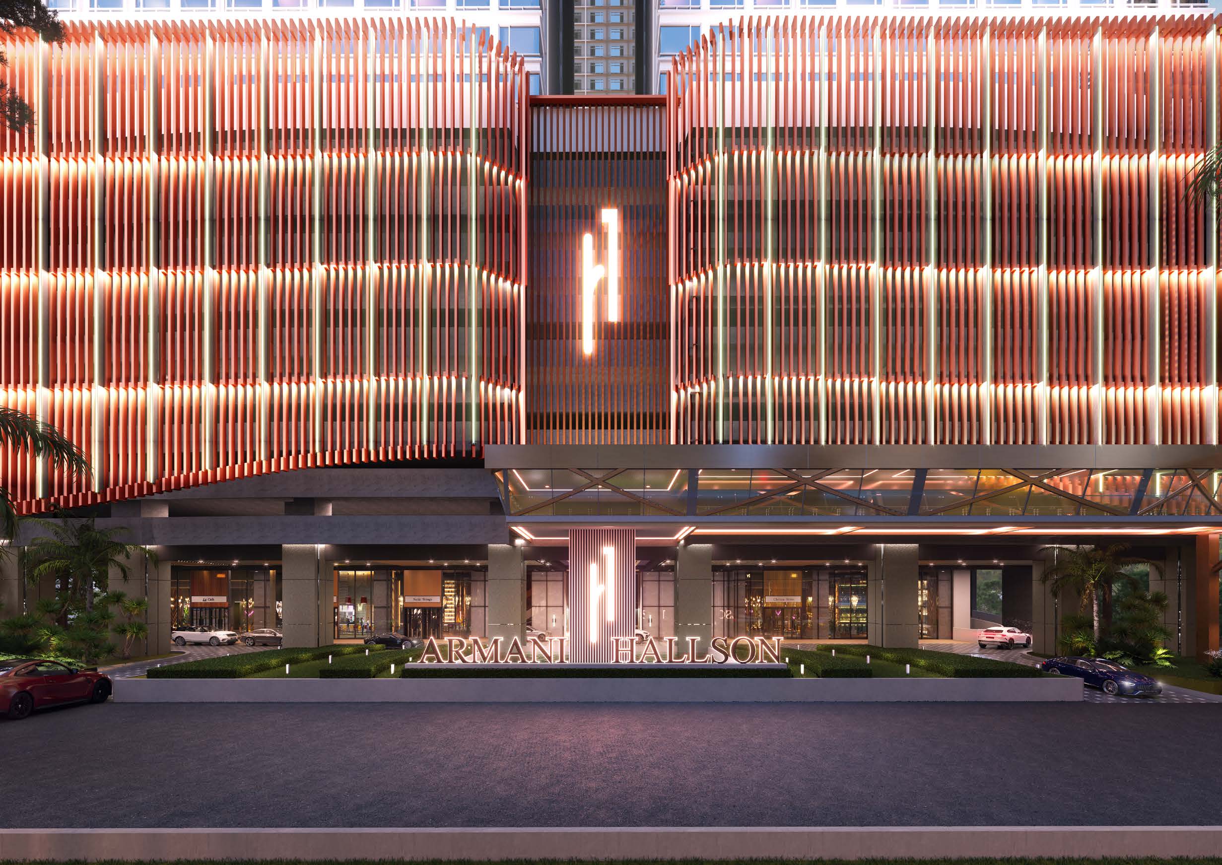 Illuminated entrance facade of Armani Hallson KLCC at night