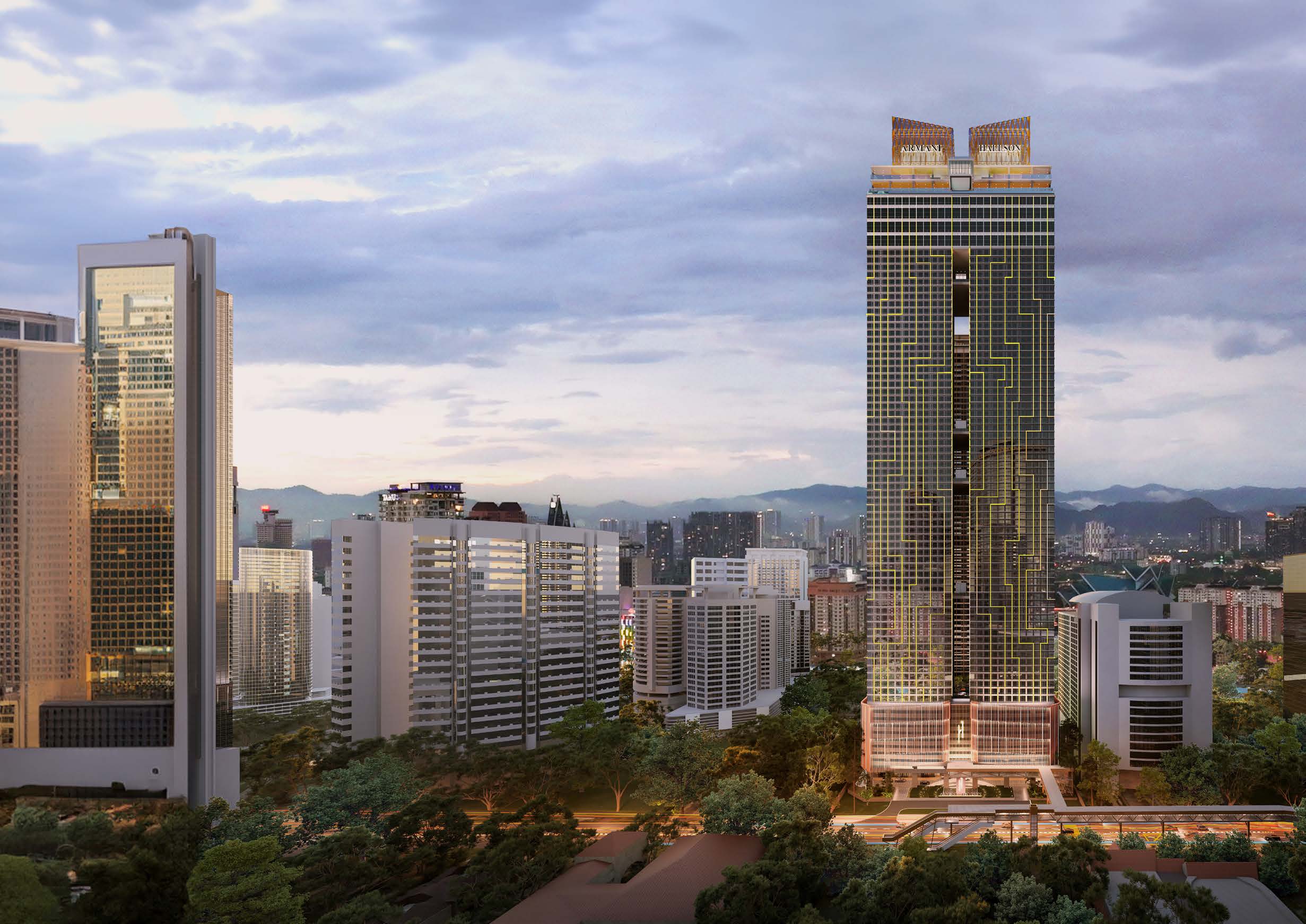Twilight exterior view of the Armani Hallson KLCC tower rising above the city